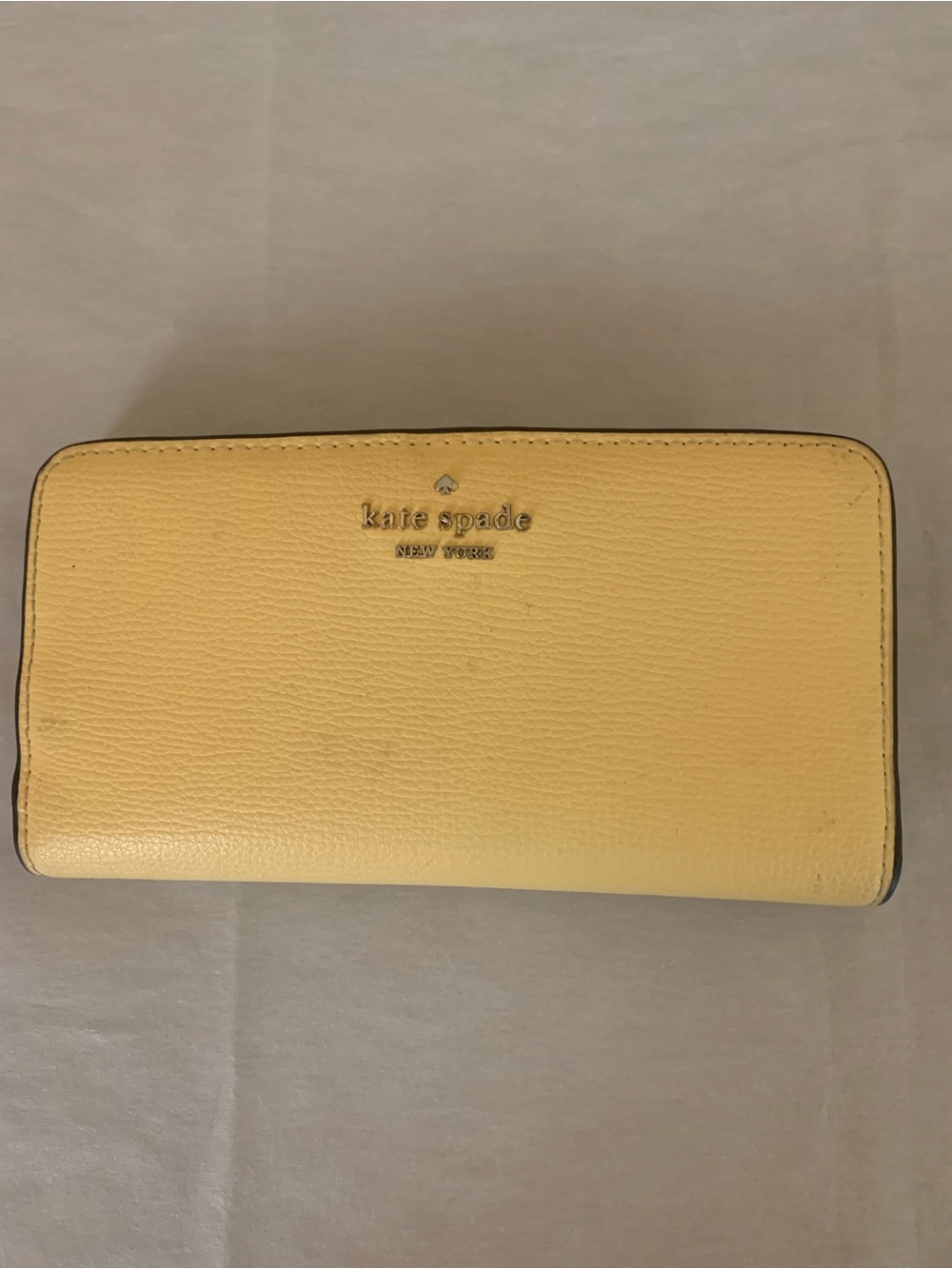 Kate Spade New York Staci Large Slim Bifold Wallet in Pale Yellow